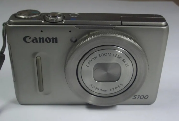 Canon PowerShot S100 Digitalkamera mit 1 Akku und Ladegerät